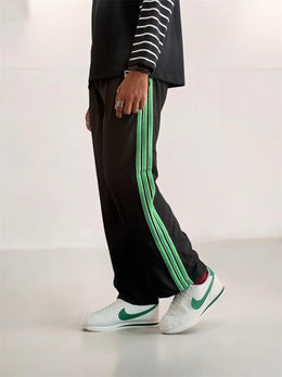 Premium straight-fit track pants for a clean, modern look (black and green )