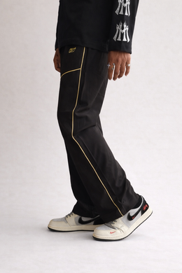Premium straight-fit track pants for a clean, modern look. A2 Black with yellow