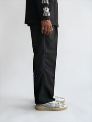 Premium straight-fit track pants for a clean, modern look. A3 Black with blue strap