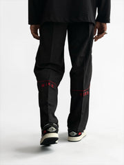 Premium straight-fit track pants for a clean, modern look. A3 Black with red line