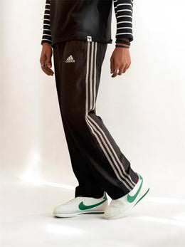 Premium straight-fit track pants for a clean, modern look (black with gray strap)