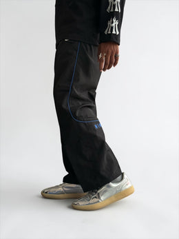 Premium straight-fit track pants for a clean, modern look. A3 Black with blue strap